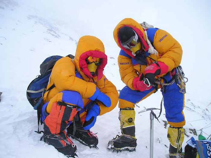 Two mountaineers during their ascent of Everest with oxygen sets.
